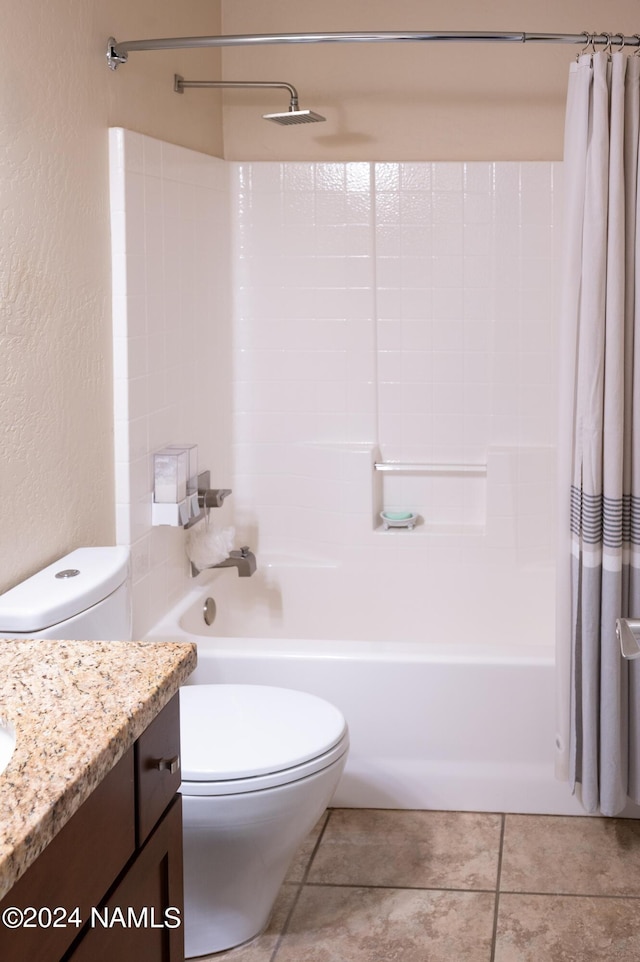 full bathroom with toilet, vanity, tile patterned floors, and shower / tub combo with curtain