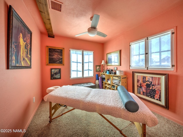 311 N Winslow Ave, Winslow, AZ 86047 - carpeted bedroom with ceiling fan, baseboards, and a textured ceiling