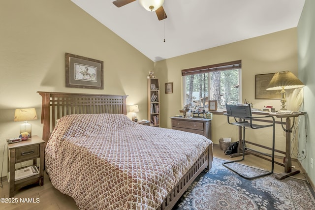 bedroom with a ceiling fan, wood finished floors, and lofted ceiling