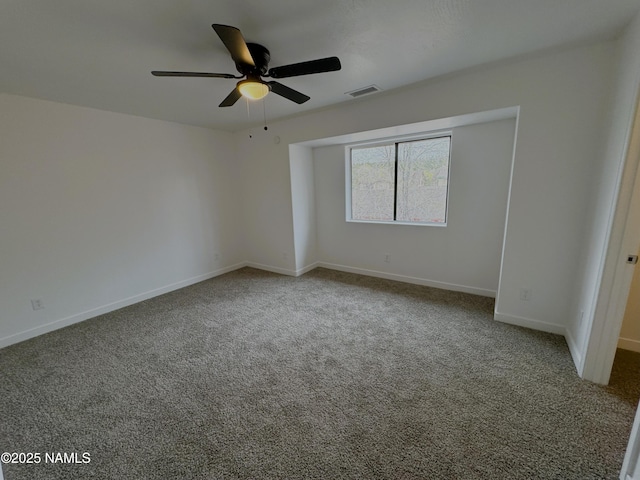 1807 N Main St, Flagstaff, AZ 86004 - carpeted spare room featuring baseboards, ceiling fan, and visible vents