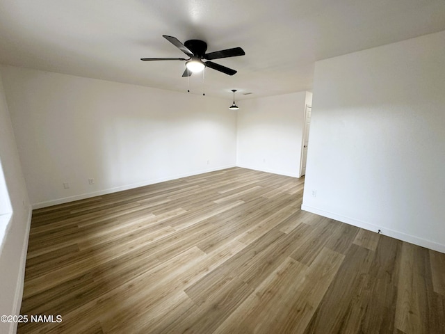 1807 N Main St, Flagstaff, AZ 86004 - spare room featuring baseboards, ceiling fan, and wood finished floors