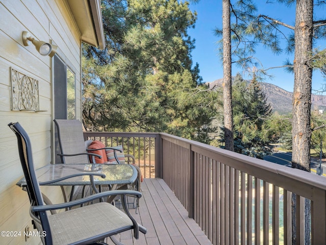 wooden terrace featuring a mountain view