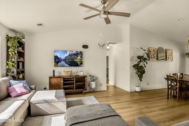9654 Heritage Dr, Flagstaff, AZ 86004 - living room with ceiling fan, light wood-style flooring, vaulted ceiling, and baseboards