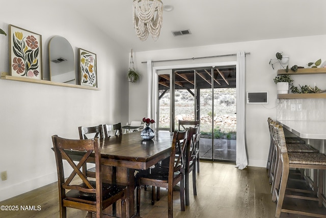 9654 Heritage Dr, Flagstaff, AZ 86004 - dining room featuring baseboards, a chandelier, and wood finished floors