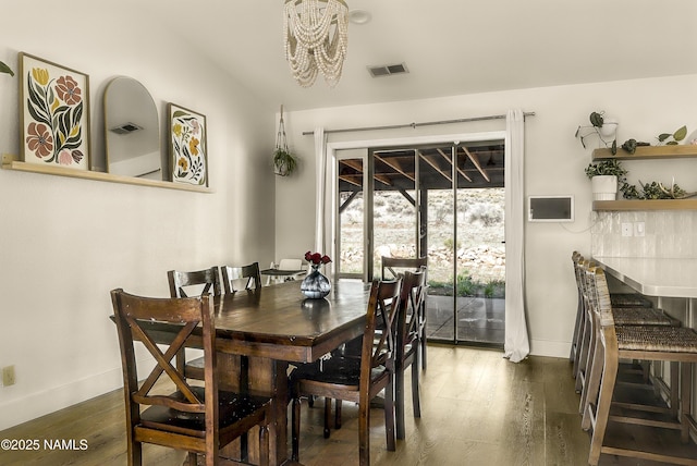 9654 Heritage Dr, Flagstaff, AZ 86004 - dining space featuring baseboards, a chandelier, and wood-type flooring