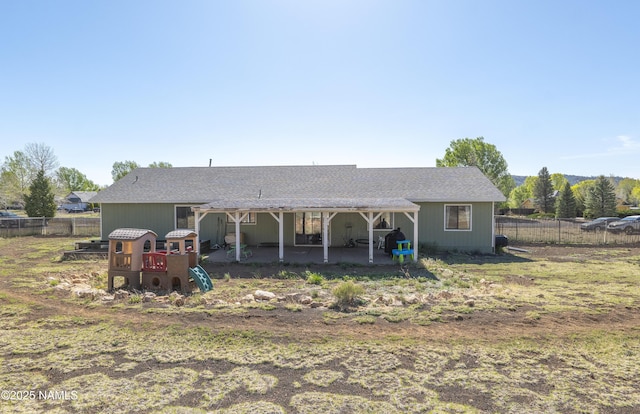 9654 Heritage Dr, Flagstaff, AZ 86004 - back of house with a patio area and roof with shingles