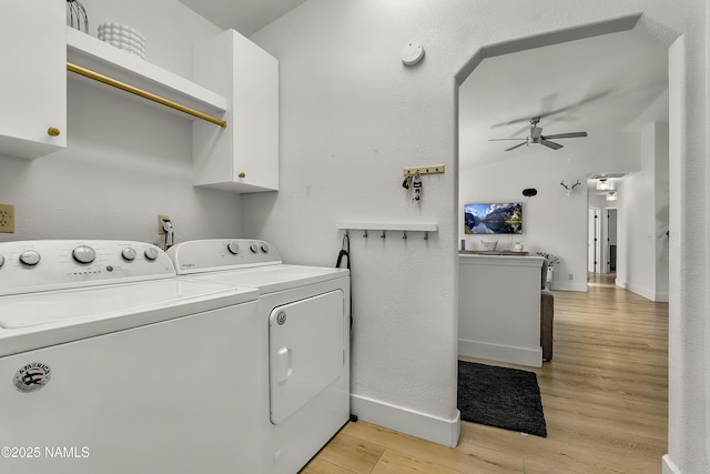 9654 Heritage Dr, Flagstaff, AZ 86004 - laundry area with a ceiling fan, independent washer and dryer, cabinet space, light wood finished floors, and baseboards