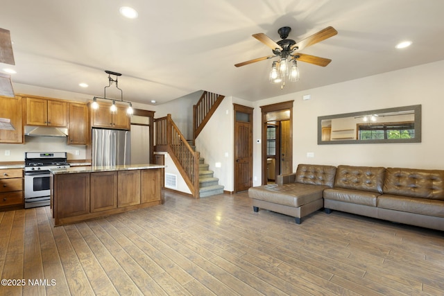 3135 Ancient Trl, Flagstaff, AZ 86005 - living room with wood finished floors, recessed lighting, stairs, and ceiling fan