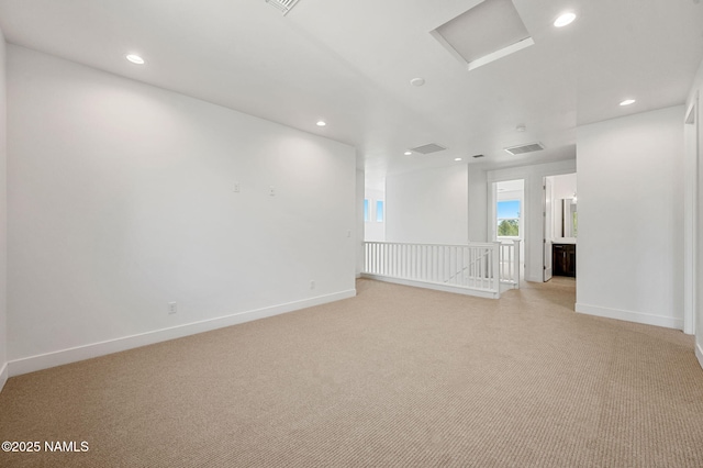 555 N Valerian Ln Lot 24, Flagstaff, AZ 86004 - unfurnished room with light colored carpet, recessed lighting, baseboards, and attic access