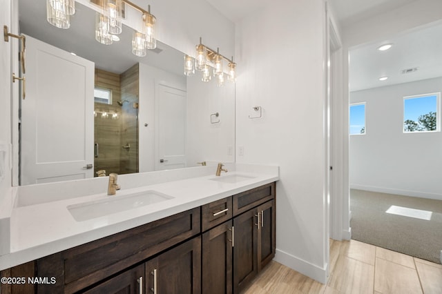 555 N Valerian Ln Lot 24, Flagstaff, AZ 86004 - bathroom with double vanity, a shower stall, baseboards, and recessed lighting
