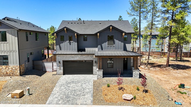 555 N Valerian Ln Lot 24, Flagstaff, AZ 86004 - modern farmhouse featuring stone siding, decorative driveway, board and batten siding, and a porch