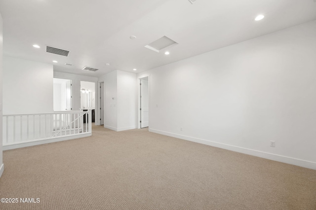 555 N Valerian Ln Lot 24, Flagstaff, AZ 86004 - spare room featuring light carpet, recessed lighting, baseboards, and attic access