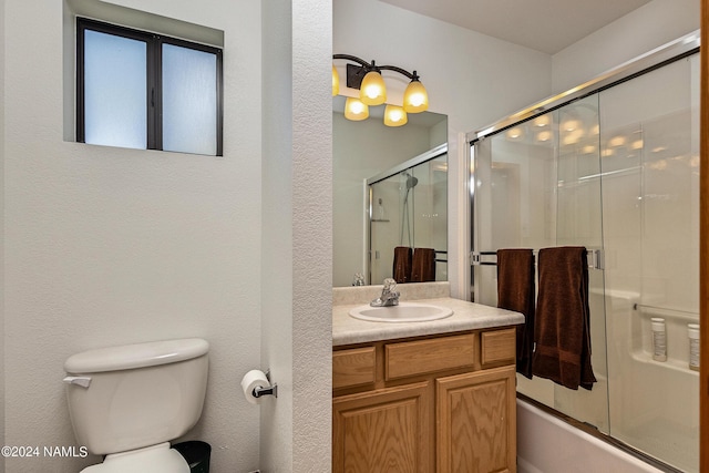 full bathroom with vanity, toilet, and enclosed tub / shower combo