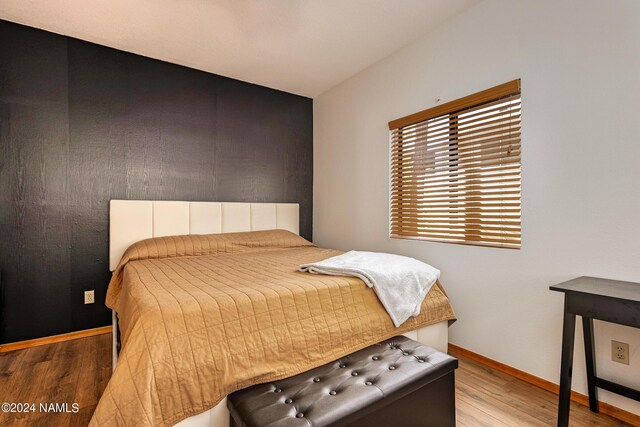 bedroom featuring hardwood / wood-style floors