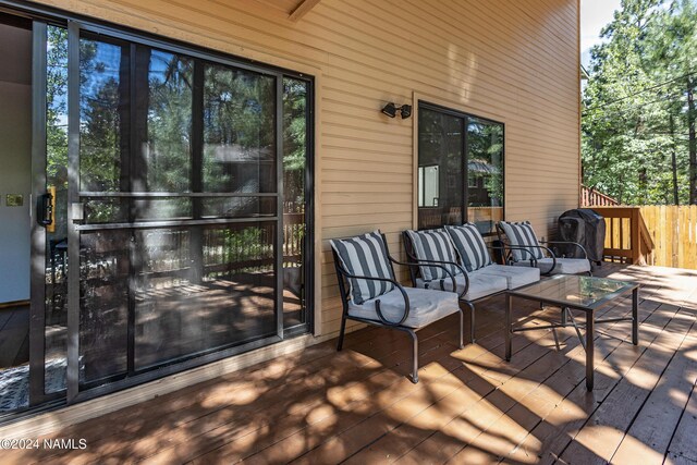 wooden terrace with outdoor lounge area