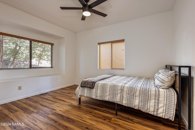 bedroom with hardwood / wood-style floors and ceiling fan