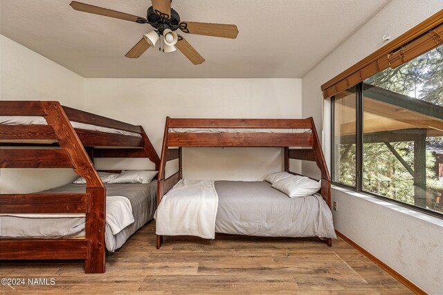 bedroom featuring hardwood / wood-style flooring and ceiling fan