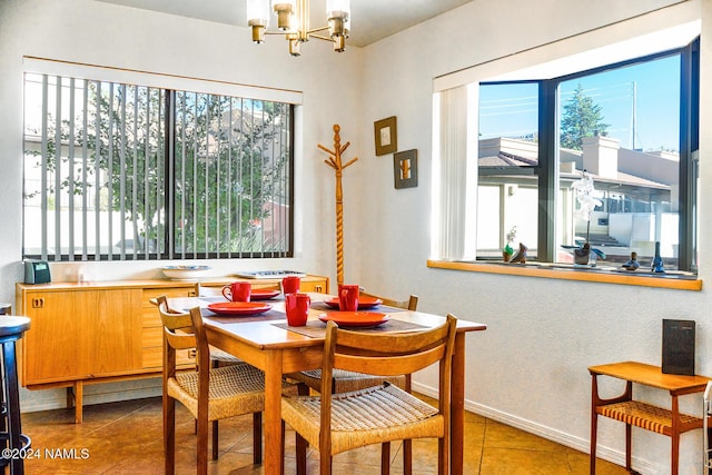 tiled dining space with an inviting chandelier