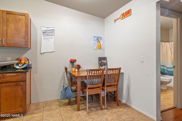 dining space featuring baseboards