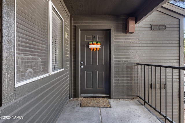 property entrance with visible vents