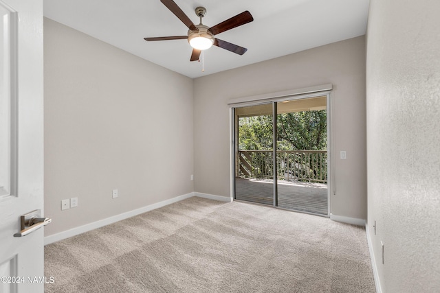 empty room with carpet, baseboards, and ceiling fan