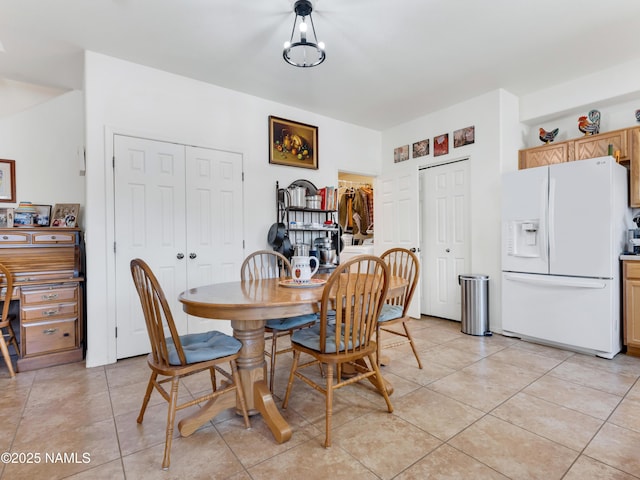 dining area featuring light tile patterned floors