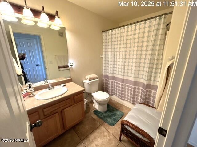 9123 W Arden Ln, Bellemont, AZ 86015 - full bathroom with toilet, a shower with curtain, tile patterned flooring, and vanity