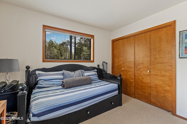 carpeted bedroom featuring a closet