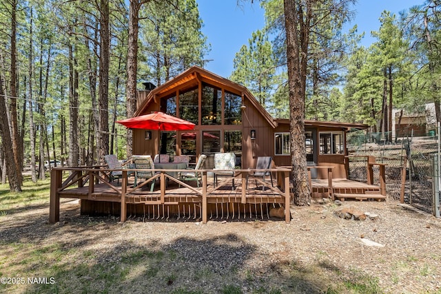 325 Lodge Dr, Munds Park, AZ 86017 - rear view of property with a chimney and a wooden deck