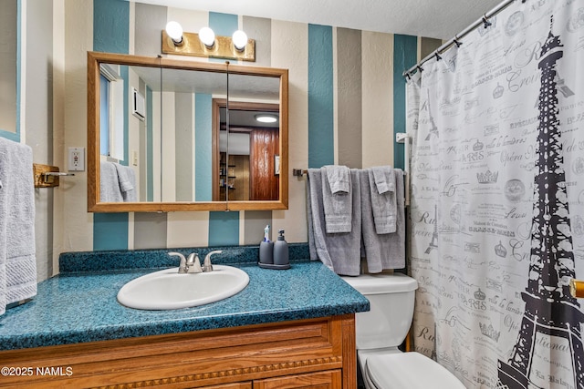 325 Lodge Dr, Munds Park, AZ 86017 - full bath with a textured wall, toilet, vanity, and curtained shower