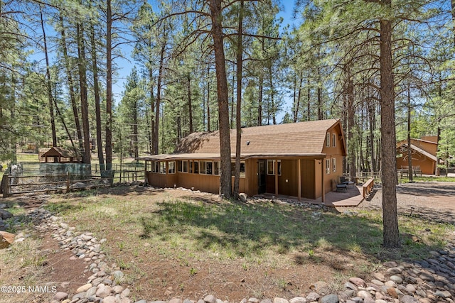 325 Lodge Dr, Munds Park, AZ 86017 - rear view of property featuring roof with shingles