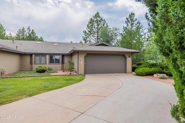 ranch-style home featuring a garage and a front lawn