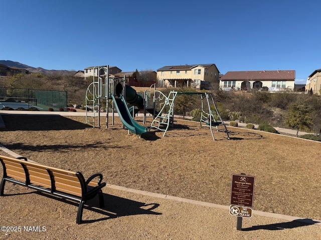 view of playground featuring a mountain view