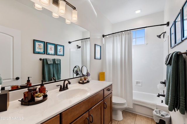 full bathroom featuring vanity, toilet, tile patterned floors, and shower / bath combo