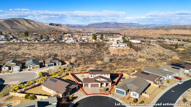 drone / aerial view featuring a mountain view