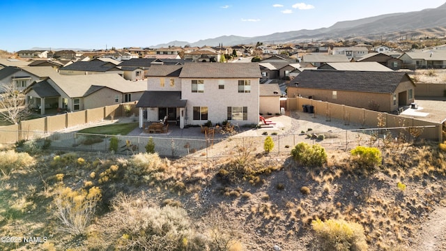 rear view of house with a mountain view