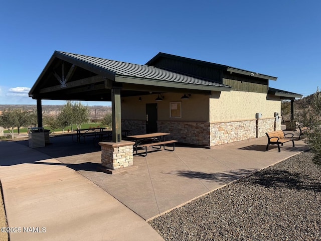 exterior space featuring ceiling fan and a gazebo