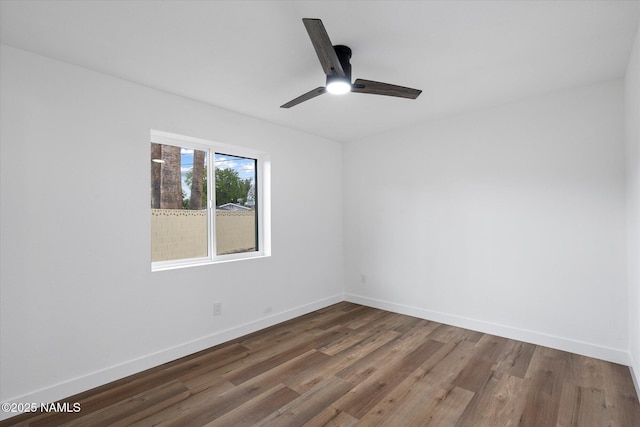 3707 E Amelia Ave, Phoenix, AZ 85018 - unfurnished room with a ceiling fan and wood finished floors