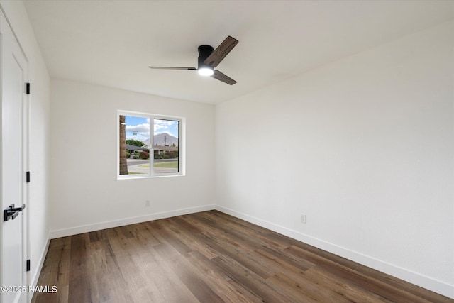 3707 E Amelia Ave, Phoenix, AZ 85018 - unfurnished bedroom with dark wood-style floors and a ceiling fan