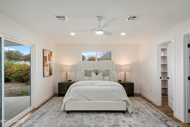 3707 E Amelia Ave, Phoenix, AZ 85018 - bedroom featuring access to outside, wood finished floors, a ceiling fan, a walk in closet, and recessed lighting
