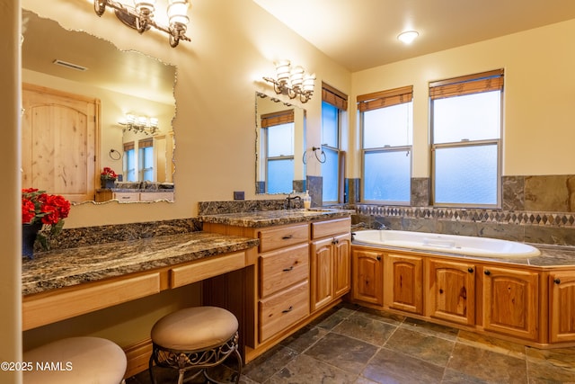 2163 S Highland Mesa Rd, Flagstaff, AZ 86001 - bathroom featuring a bathing tub, tile walls, and vanity
