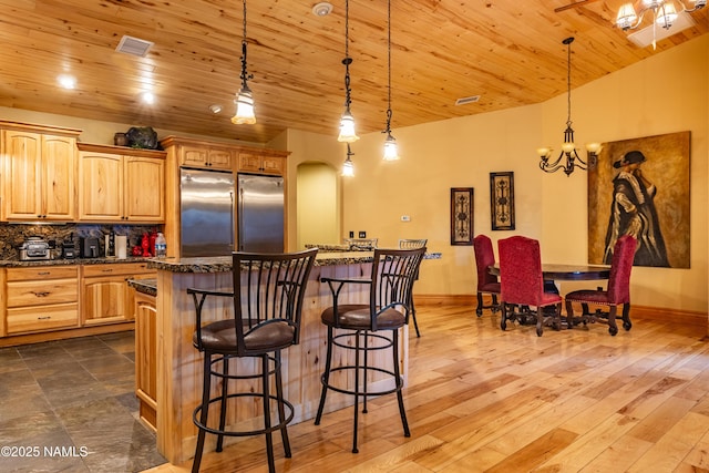 2163 S Highland Mesa Rd, Flagstaff, AZ 86001 - kitchen with decorative light fixtures, wooden ceiling, and tasteful backsplash