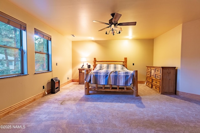 2163 S Highland Mesa Rd, Flagstaff, AZ 86001 - bedroom featuring light colored carpet, heating unit, and ceiling fan