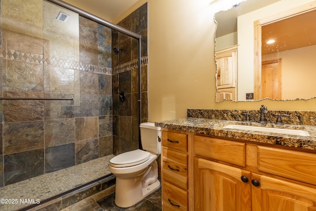 2163 S Highland Mesa Rd, Flagstaff, AZ 86001 - bathroom with toilet, vanity, and a tile shower