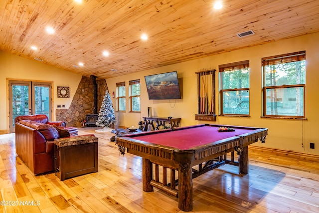 2163 S Highland Mesa Rd, Flagstaff, AZ 86001 - recreation room with wood ceiling, a wood stove, light hardwood / wood-style flooring, and vaulted ceiling