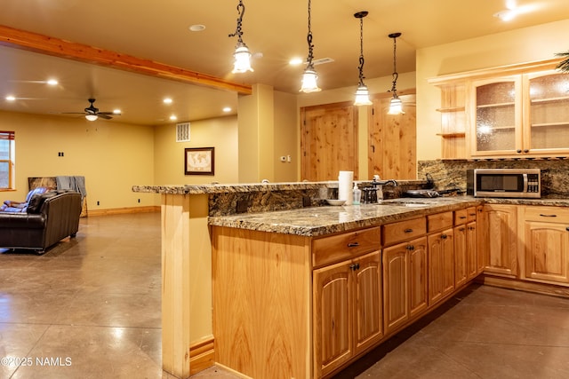 2163 S Highland Mesa Rd, Flagstaff, AZ 86001 - kitchen with sink, backsplash, kitchen peninsula, and decorative light fixtures