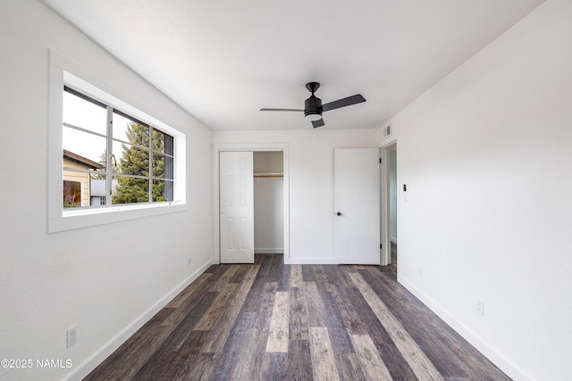 2814 N Patterson Blvd, Flagstaff, AZ 86004 - unfurnished bedroom featuring wood finished floors, baseboards, a closet, and a ceiling fan