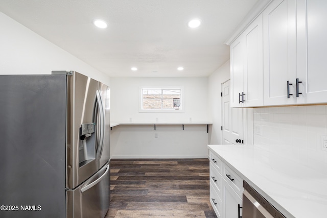 2814 N Patterson Blvd, Flagstaff, AZ 86004 - kitchen with stainless steel appliances, white cabinetry, recessed lighting, dark wood finished floors, and backsplash