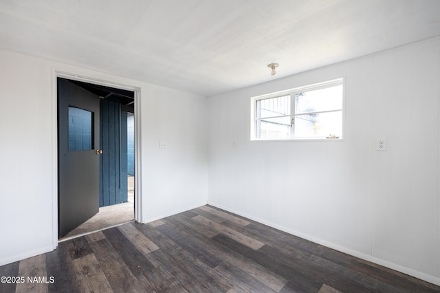2814 N Patterson Blvd, Flagstaff, AZ 86004 - unfurnished room with dark wood-style floors and baseboards