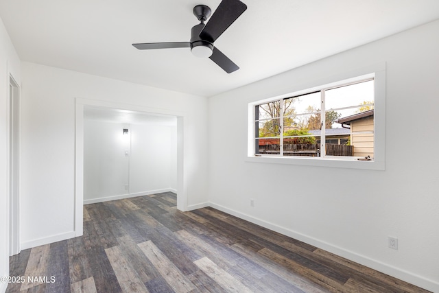 2814 N Patterson Blvd, Flagstaff, AZ 86004 - unfurnished room with baseboards, dark wood finished floors, and ceiling fan